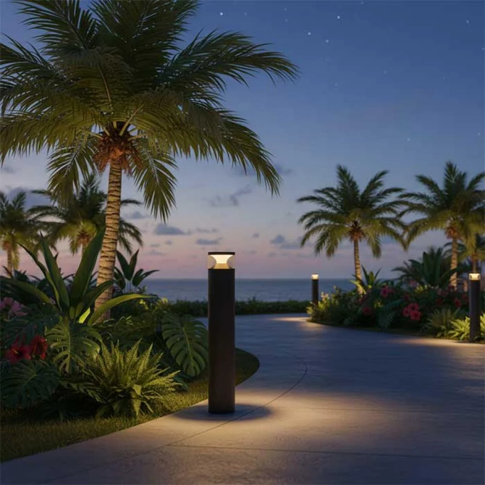 Outdoor lighting illuminating front walkway and garden beds at dusk